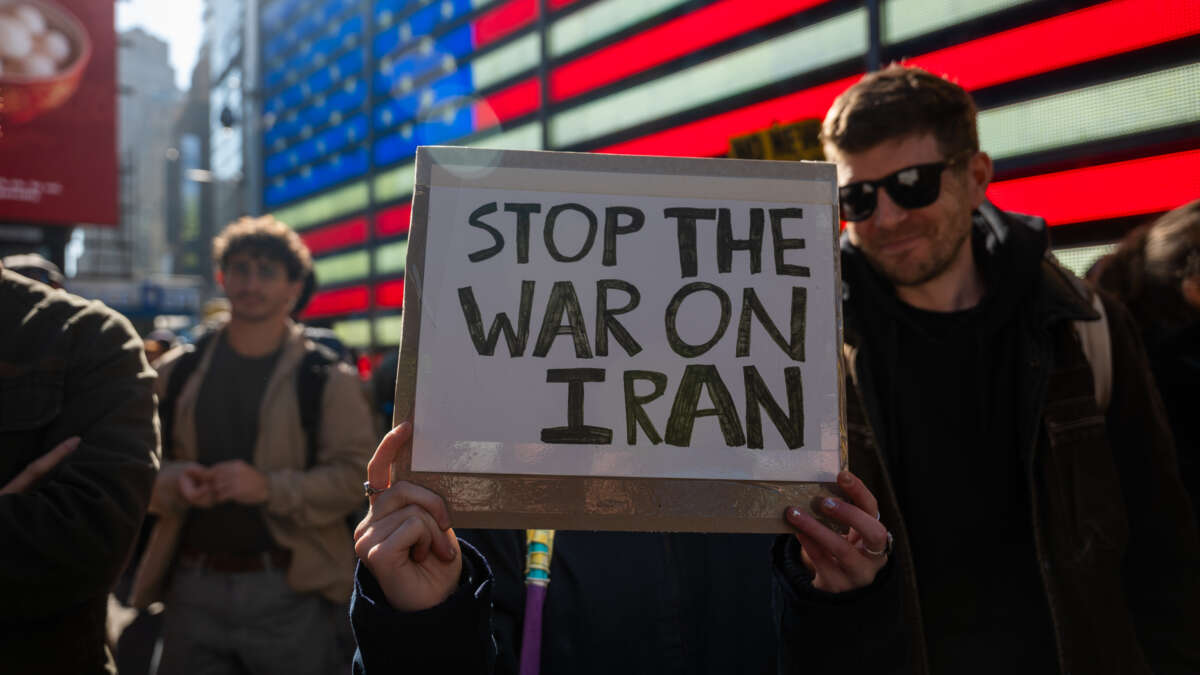 People gather in Times Square as the nation reacts to "major combat operations" in Iran on February 28, 2026, in New York City.